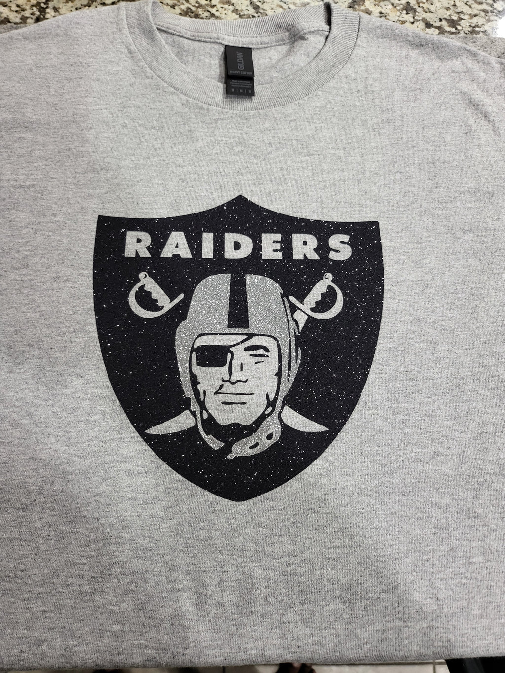 Raiders Glitter Logo T-Shirt – Silver & Black Sparkle Fan Tee (silver helmet)