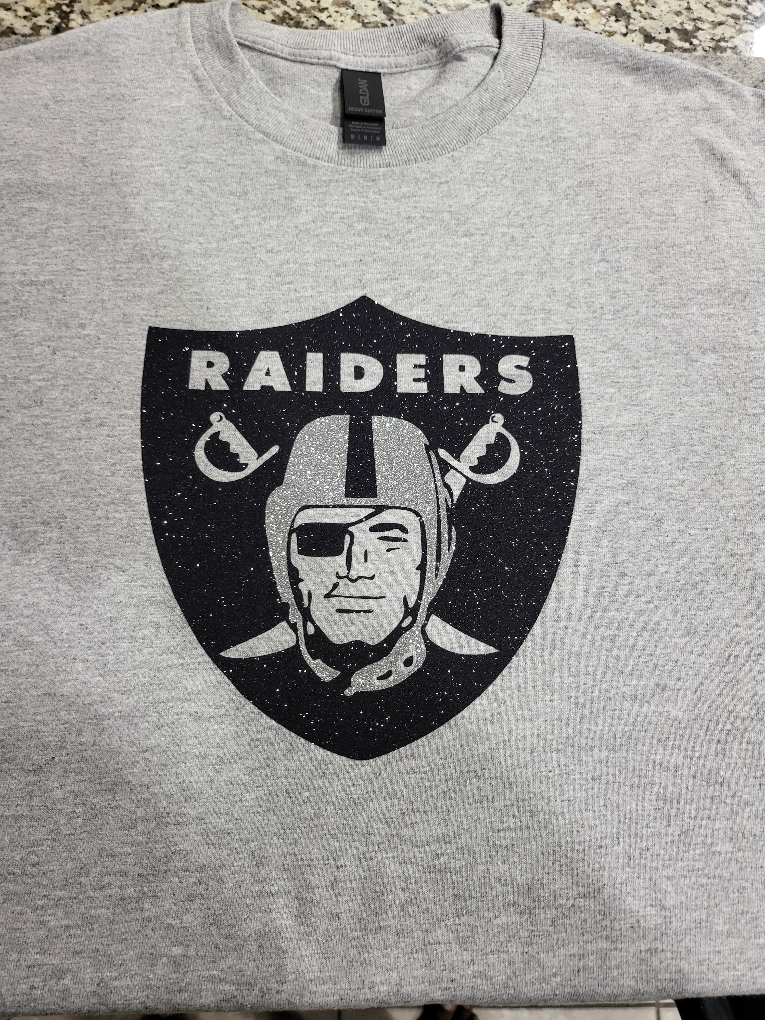 Raiders Glitter Logo T-Shirt – Silver & Black Sparkle Fan Tee (silver helmet)