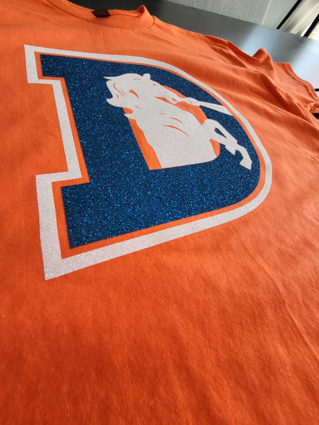 Denver Broncos Glitter Logo T-Shirt – Orange & Blue Sparkle Fan Tee