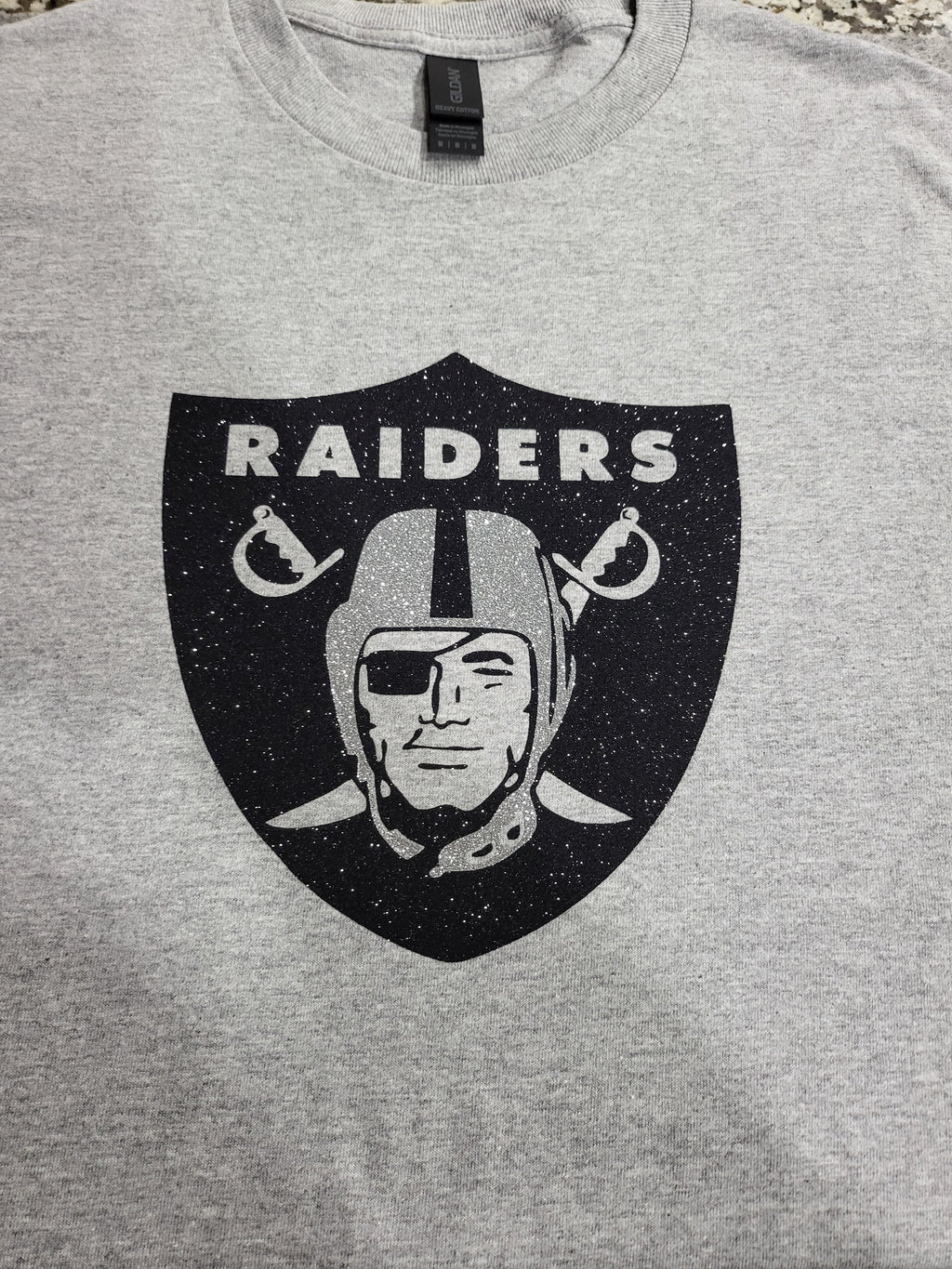 Raiders Glitter Logo T-Shirt – Silver & Black Sparkle Fan Tee (silver helmet)